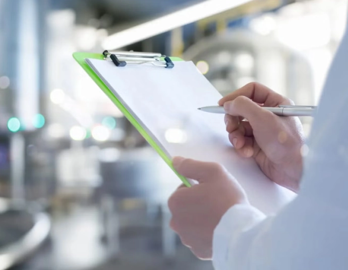 Metrology technician comparing a translated calibration certificate with a gage block set