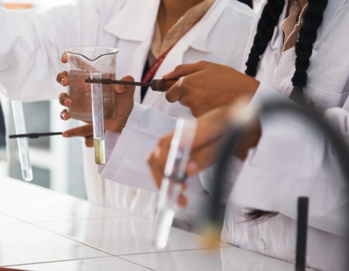 Chemical plant operator reviewing translated safety data sheets and GHS labels