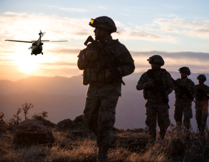 Defense contractor reviewing translated technical documentation for an allied program