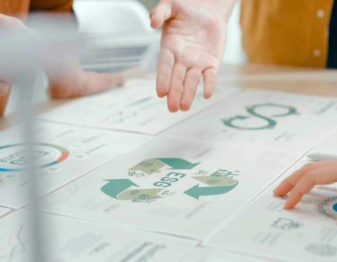 Translated environmental impact statement volumes on a project review table