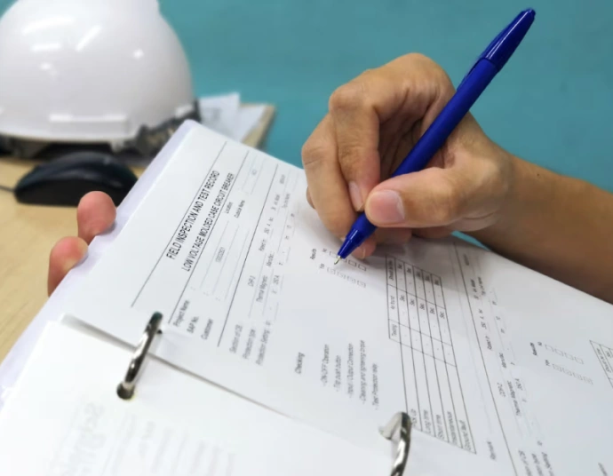 Translator reviewing a 16-section GHS safety data sheet on screen