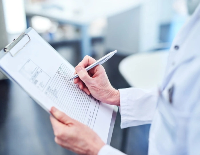 Laboratory test report with measurement tables being reviewed for translation