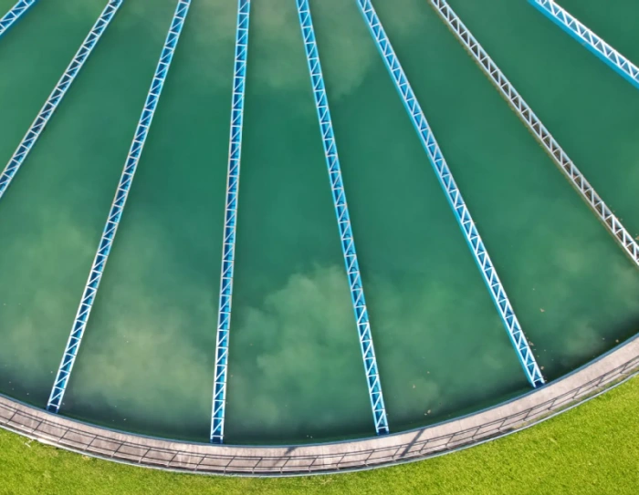 Operator inspecting membrane filtration skids at a municipal water treatment plant